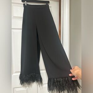 Gianni Bini flowing pants with feather cuffs.